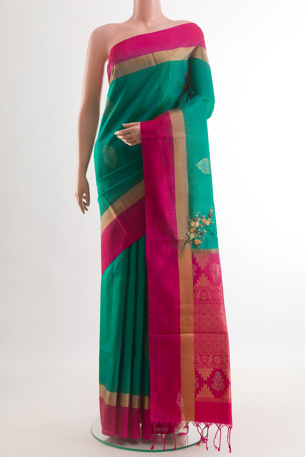 Sea Green Soft Silk Saree with Zari Butta on the body and Zari Border.  displayed on a mannequin