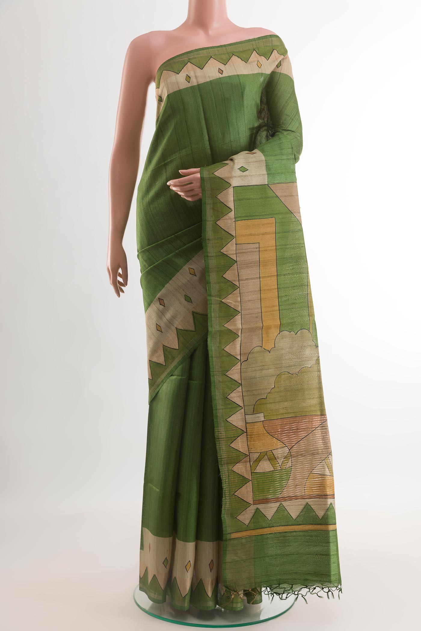 Green Tussar Silk Saree with Plain Body and Printed Border.  displayed on a mannequin