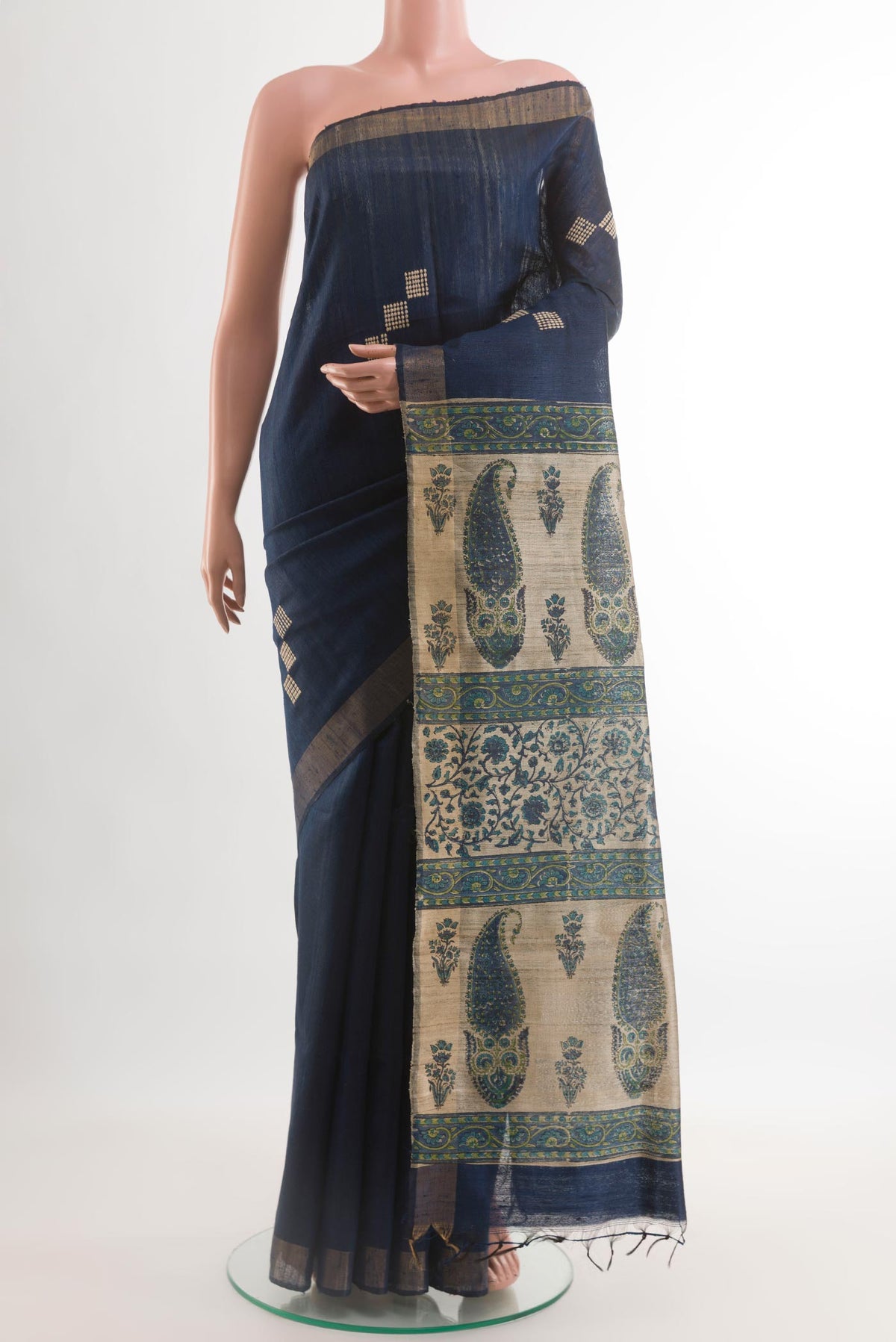 Navy Blue Tussar Saree with Thread Butta on the body and Zari Border.  displayed on a mannequin