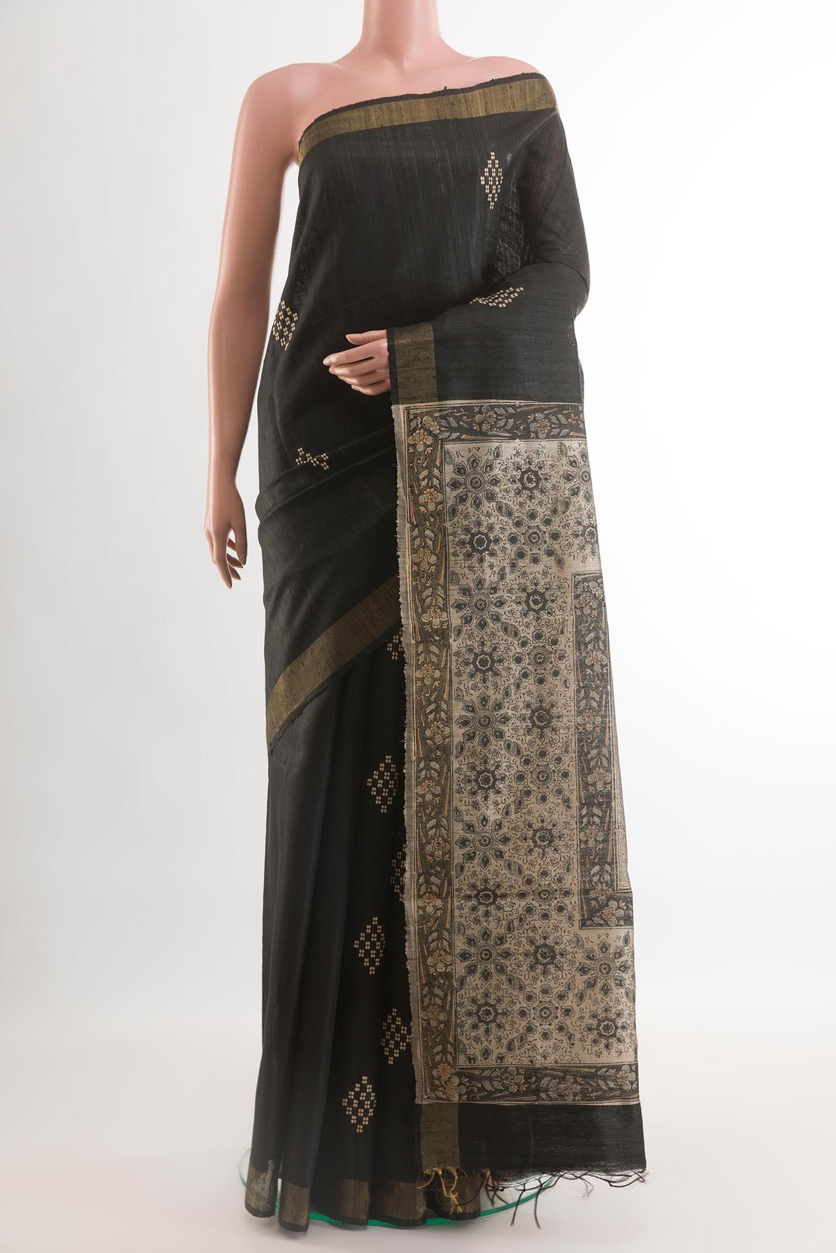 Black Tussar Silk Saree with Thread Butta on the body and Zari Border.  displayed on a mannequin