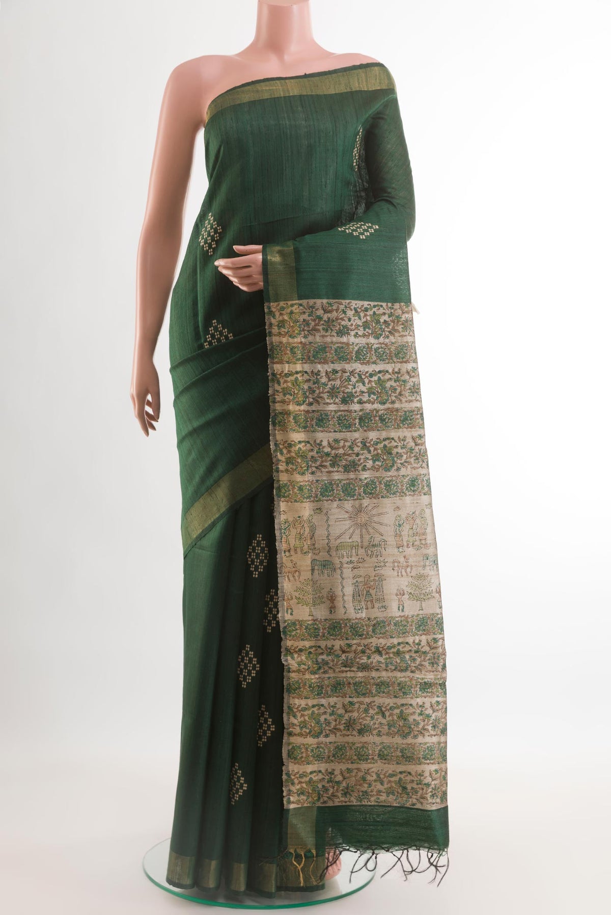 Bottle Green Tussar Silk Saree with Thread Butta on the body and Zari Border.  displayed on a mannequin