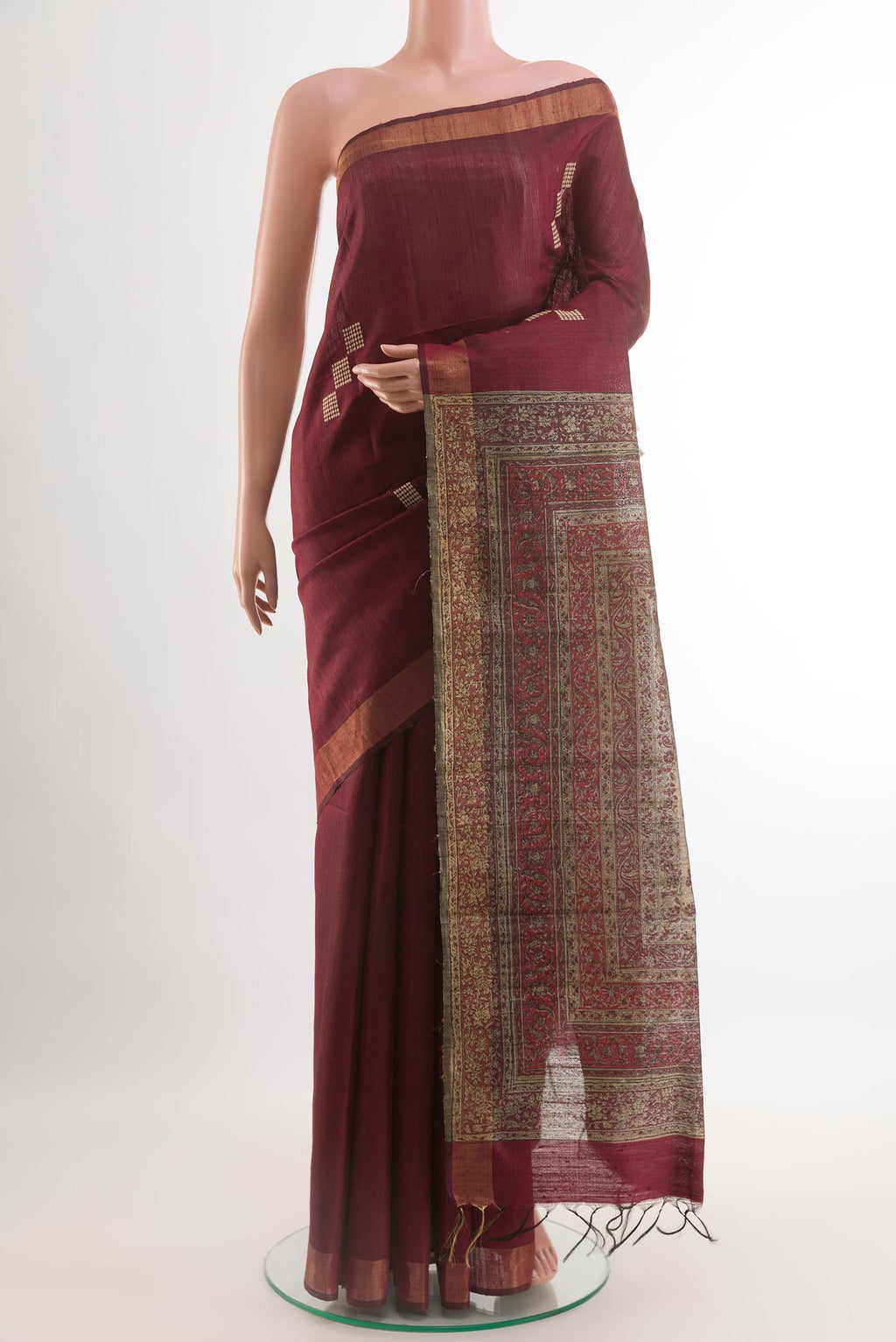 Coffee Brown Tussar Silk Saree with Thread Butta on the body and Zari Border.  displayed on a mannequin
