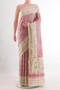 Off White Rajkot Patola Silk Saree with Ikat design on the body and Zari Border.  displayed on a mannequin