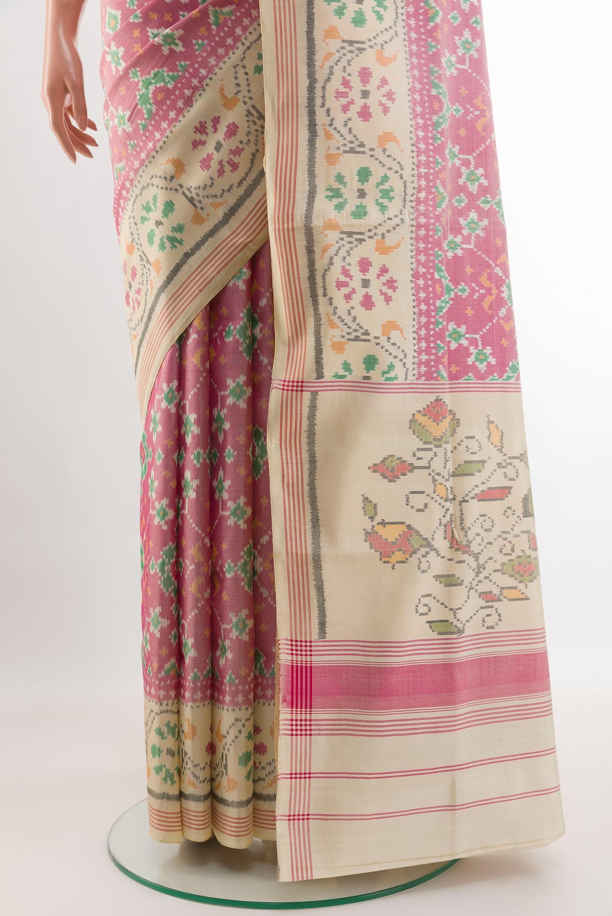 Pleats and pallu of Off White Rajkot Patola Silk Saree with Ikat design on the body and Zari Border. 