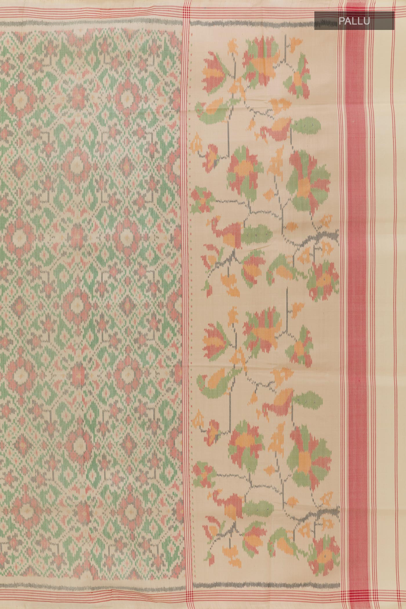 Close up image of the pallu of Cream Rajkot Patola Silk Saree with Pure Ikat on the body and Zari Border. 