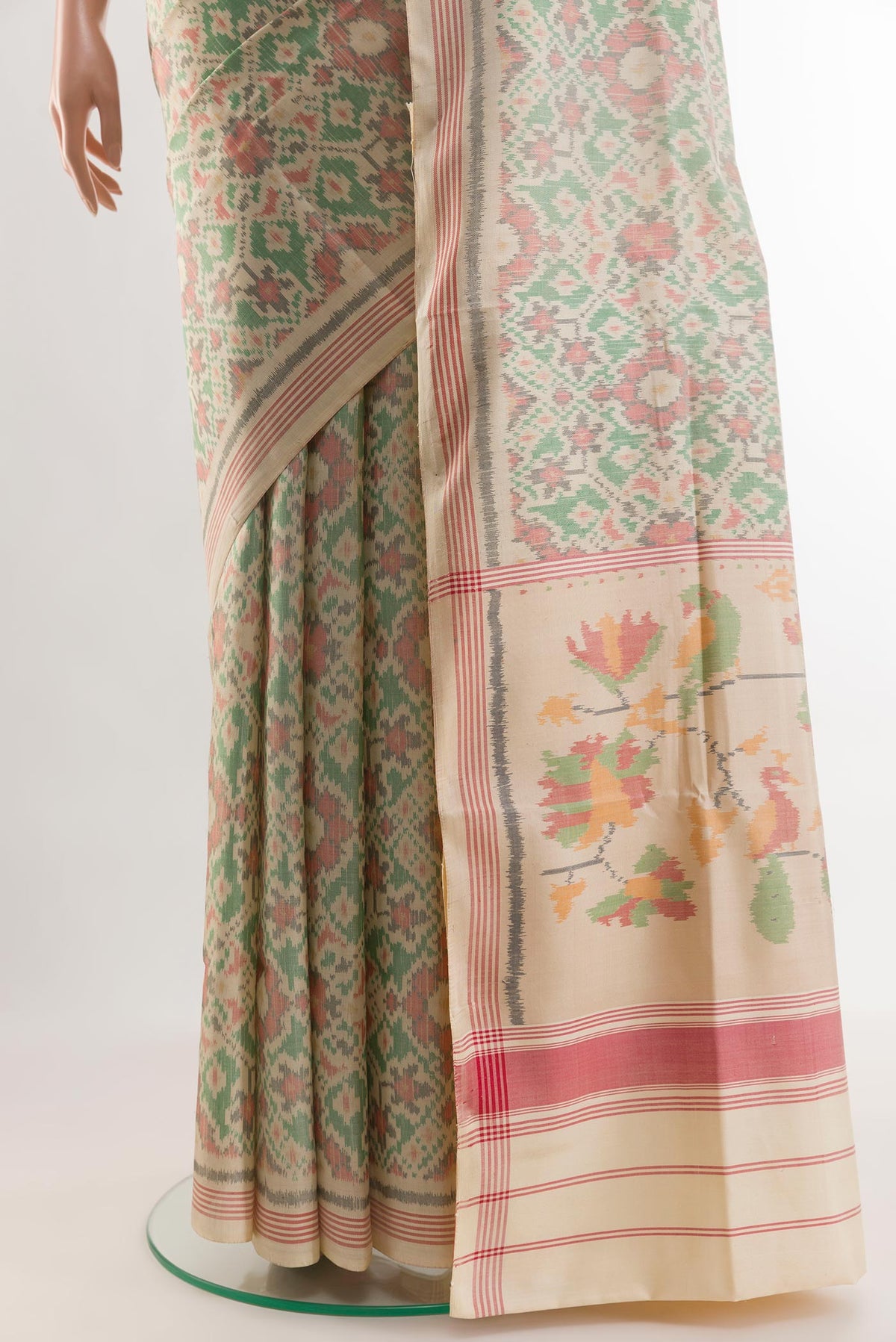 Pleats and pallu of Cream Rajkot Patola Silk Saree with Pure Ikat on the body and Zari Border. 