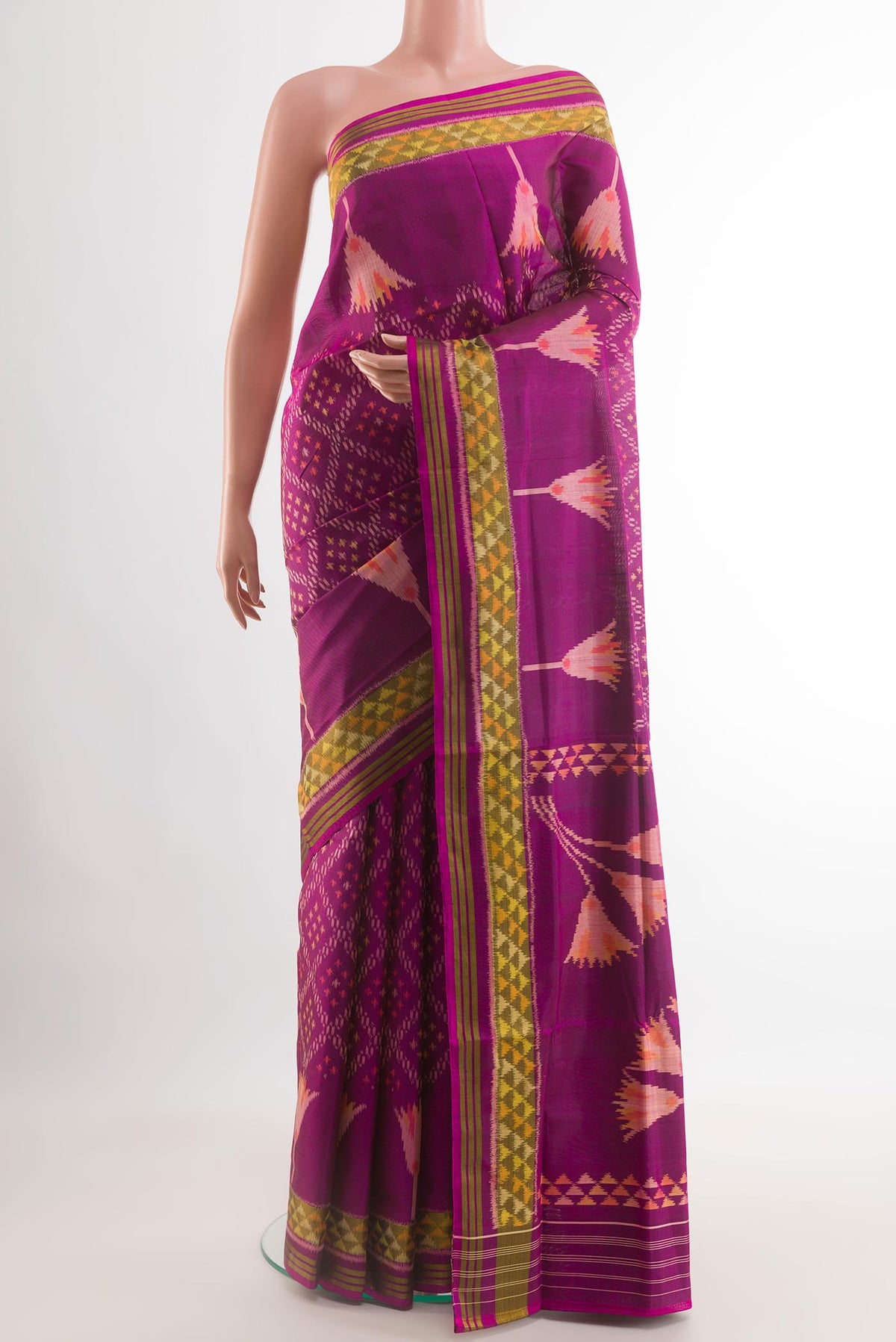 Purple Rajkot Patola Silk Saree with Ikat design on the body and Zari Border.  displayed on a mannequin