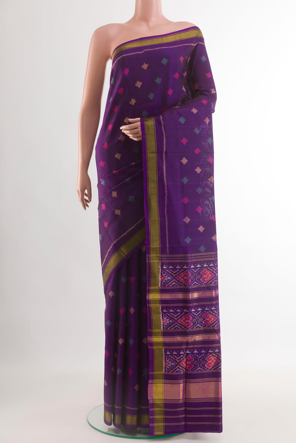 Violet Rajkot Patola Silk Saree with Pure Ikat on the body and Zari Border.  displayed on a mannequin