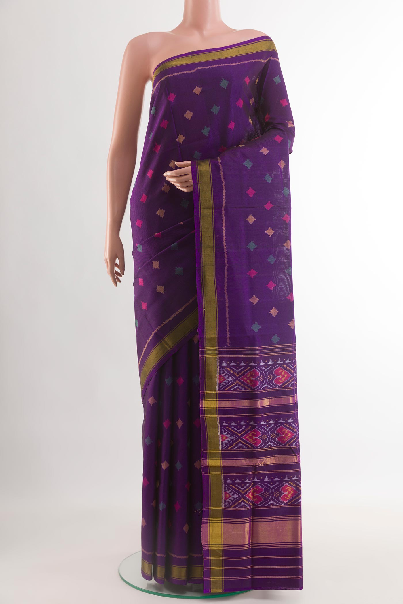 Violet Rajkot Patola Silk Saree with Pure Ikat on the body and Zari Border.  displayed on a mannequin