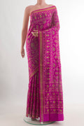 Magenta Rajkot Patola Silk Saree with Pure Ikat on the body and Zari Border.  displayed on a mannequin