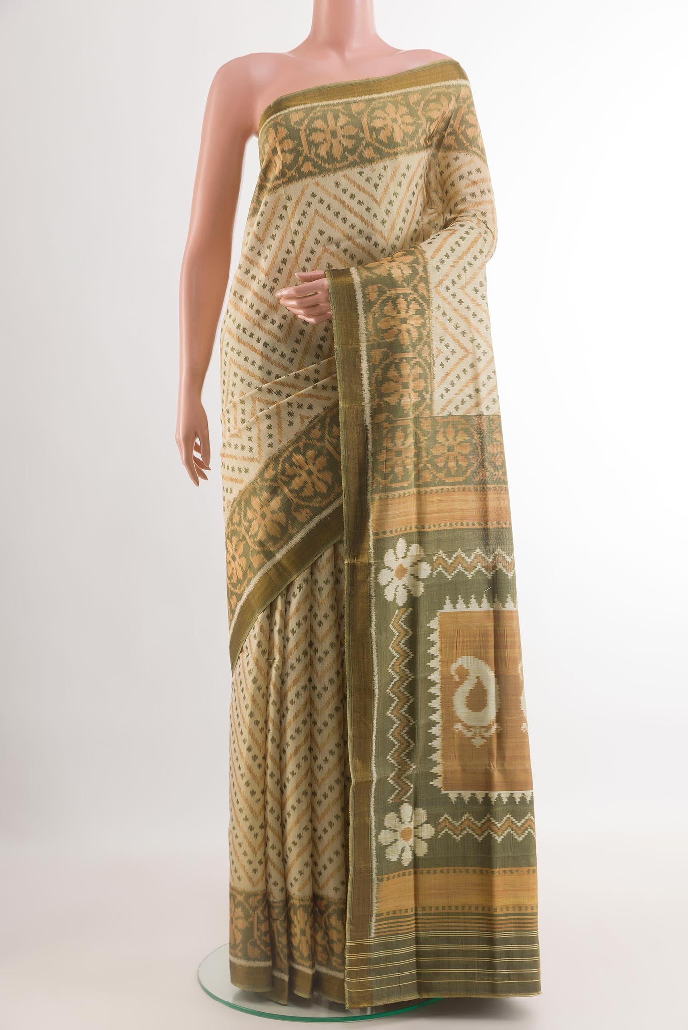 Green Rajkot Patola Silk Saree with Pure Ikat on the body and Ikat Border.  displayed on a mannequin