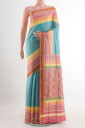 Blue Rajkot Patola Silk Saree with Ikat design on the body and Zari Border.  displayed on a mannequin