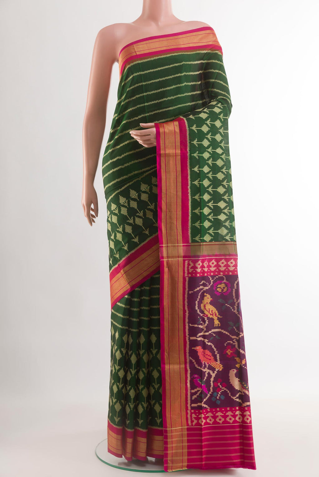 Acid Green Rajkot Patola Silk Saree with Pure Ikat on the body and Zari Border.  displayed on a mannequin