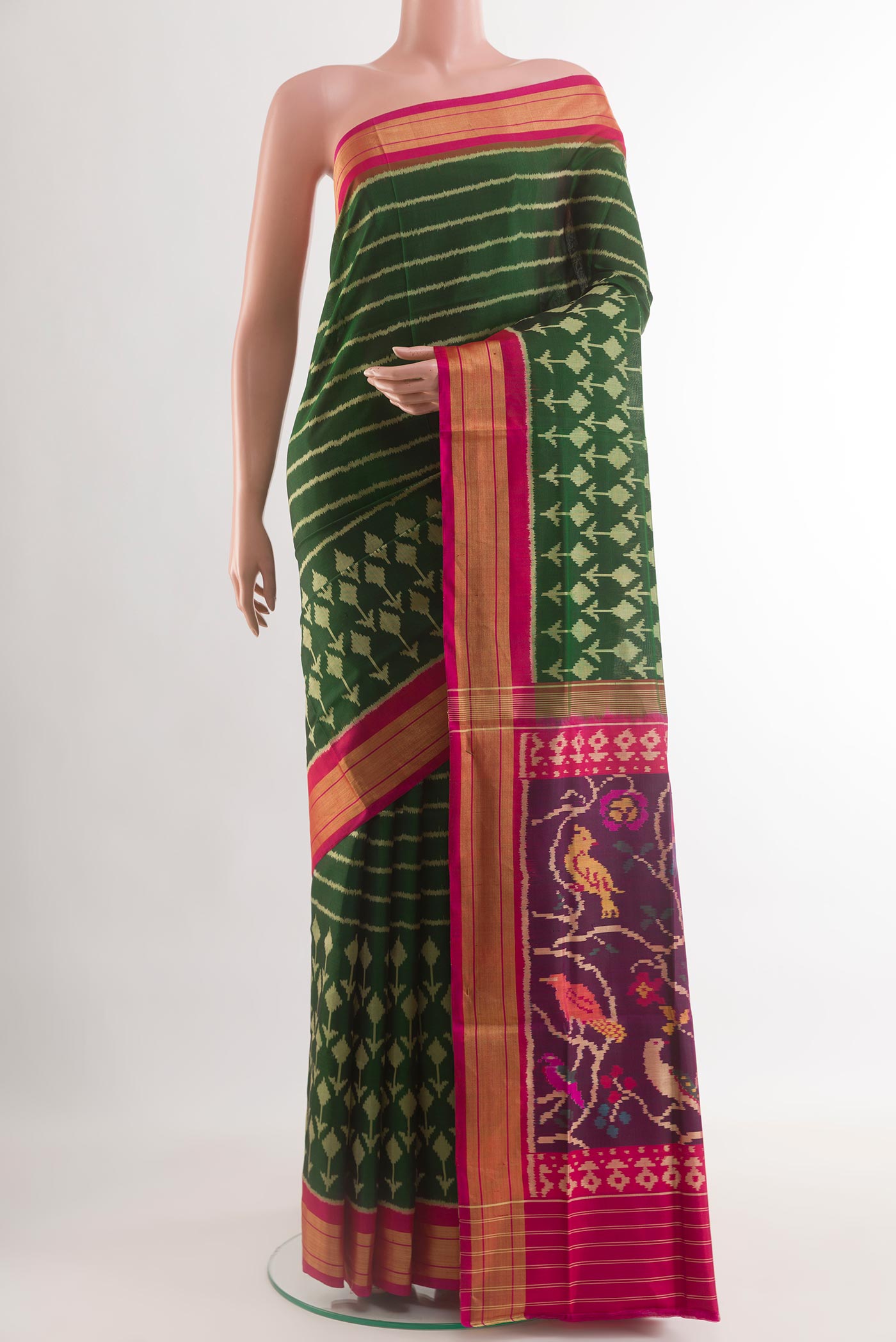 Acid Green Rajkot Patola Silk Saree with Pure Ikat on the body and Zari Border.  displayed on a mannequin