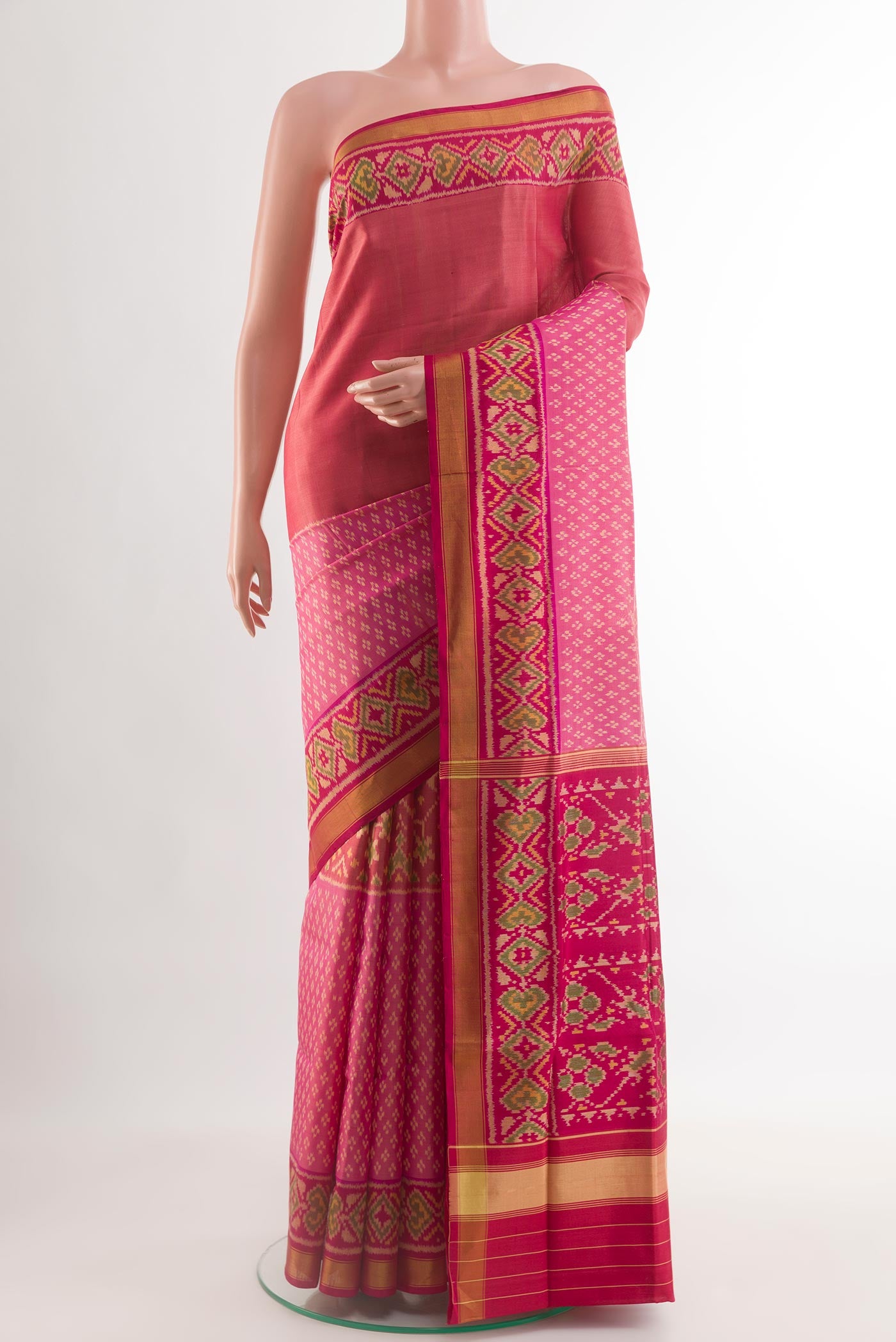 Multi Color Rajkot Patola Silk Saree with Pure Ikat on the body and Zari Border.  displayed on a mannequin