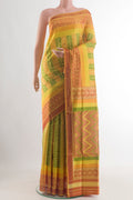 Yellow Pochampally Silk Saree with Pure Ikat on the body and Ikat Border.  displayed on a mannequin