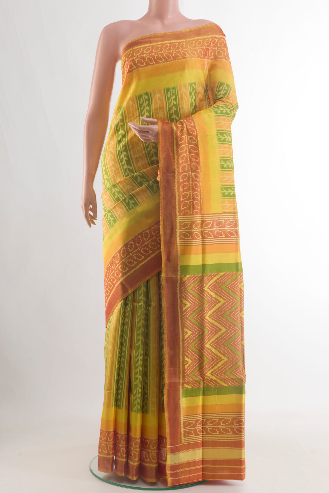 Yellow Pochampally Silk Saree with Pure Ikat on the body and Ikat Border.  displayed on a mannequin
