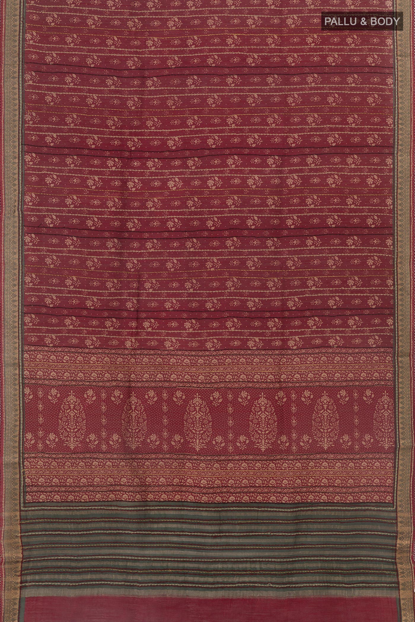 Flat view of Maroon Tussar Saree with Printed design on the body and Zari Border. 