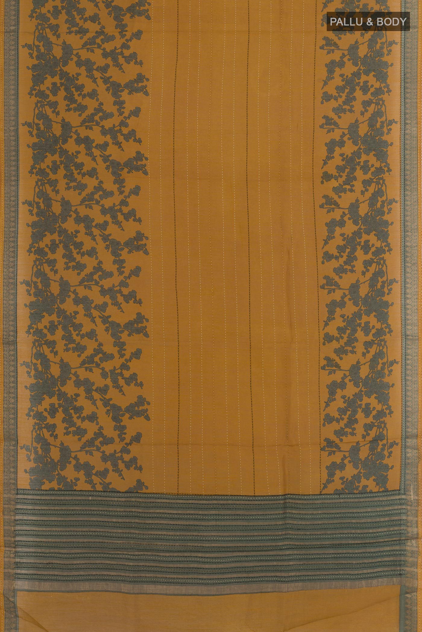 Flat view of Mustard Tussar Saree with Printed design on the body and Zari Border. 