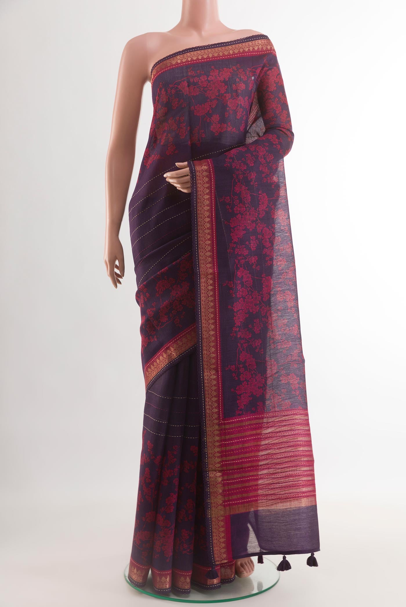 Purple Tussar Saree with Printed design on the body and Zari Border.  displayed on a mannequin