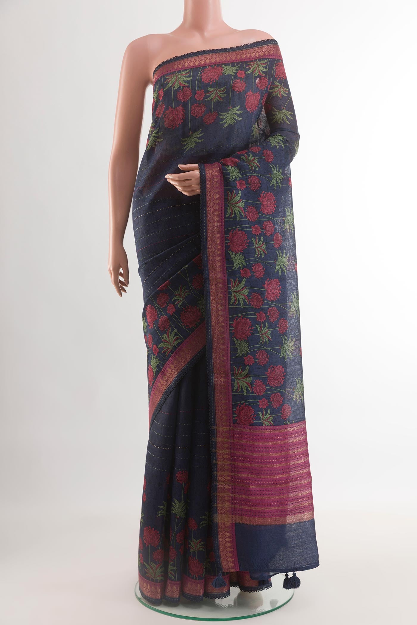 Navy Blue Tussar Saree with Stripes on the body and Zari Border.  displayed on a mannequin
