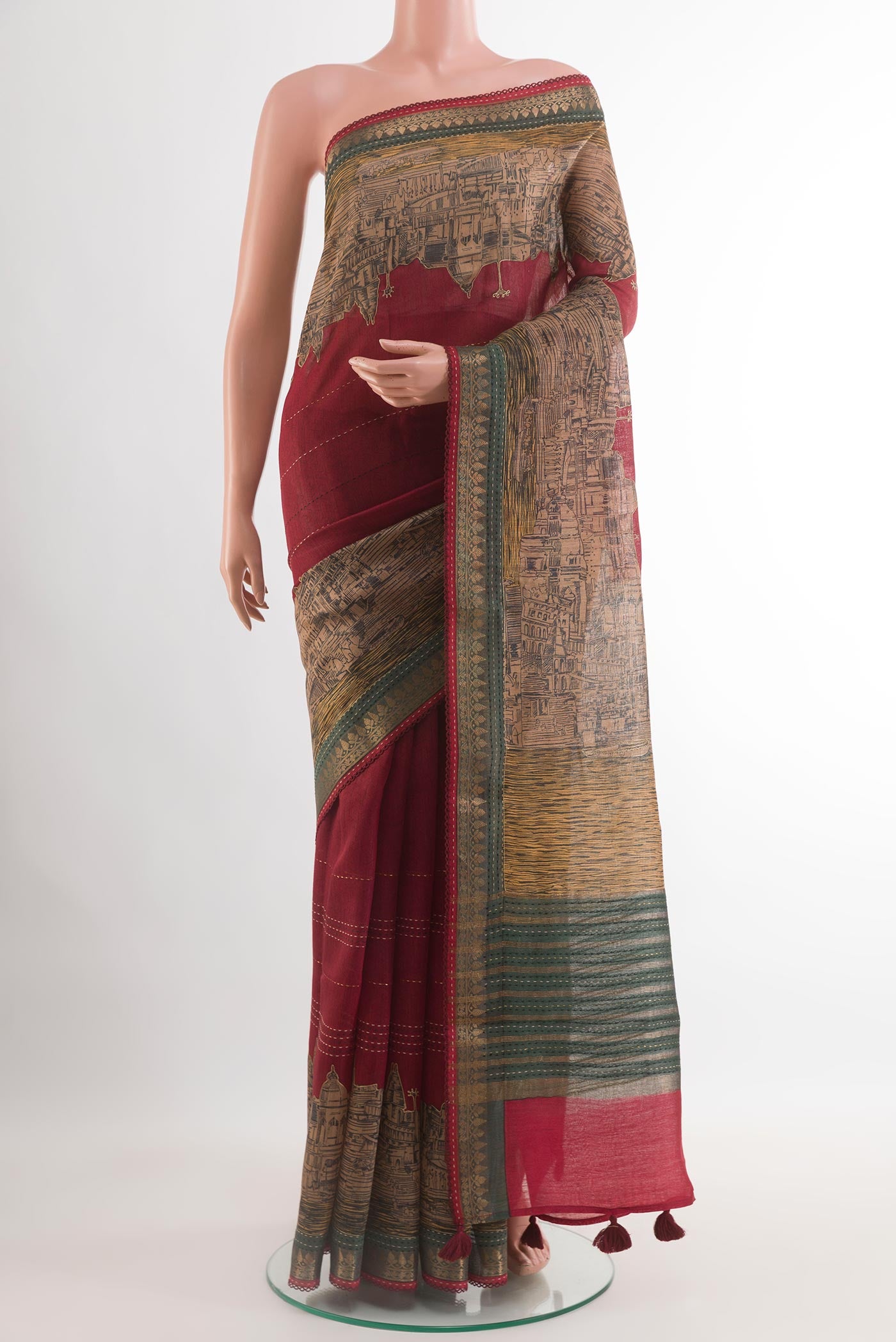 Maroon Tussar Saree with Stripes on the body and Zari Border.  displayed on a mannequin