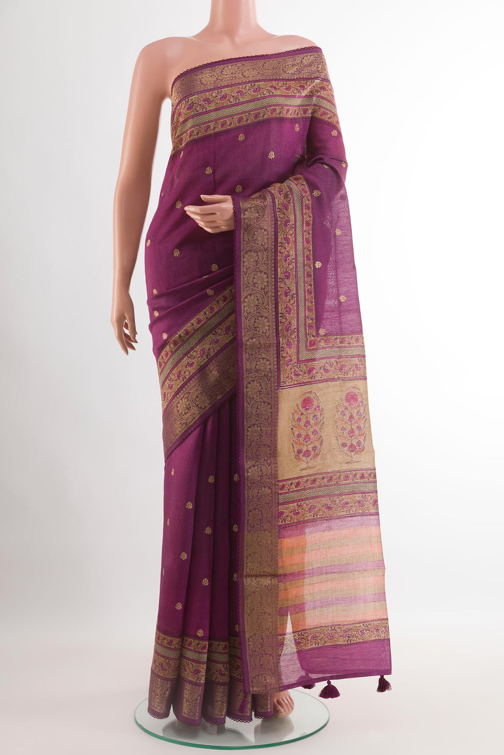 Purple Tussar Saree with Zari Butta on the body and Zari Border.  displayed on a mannequin