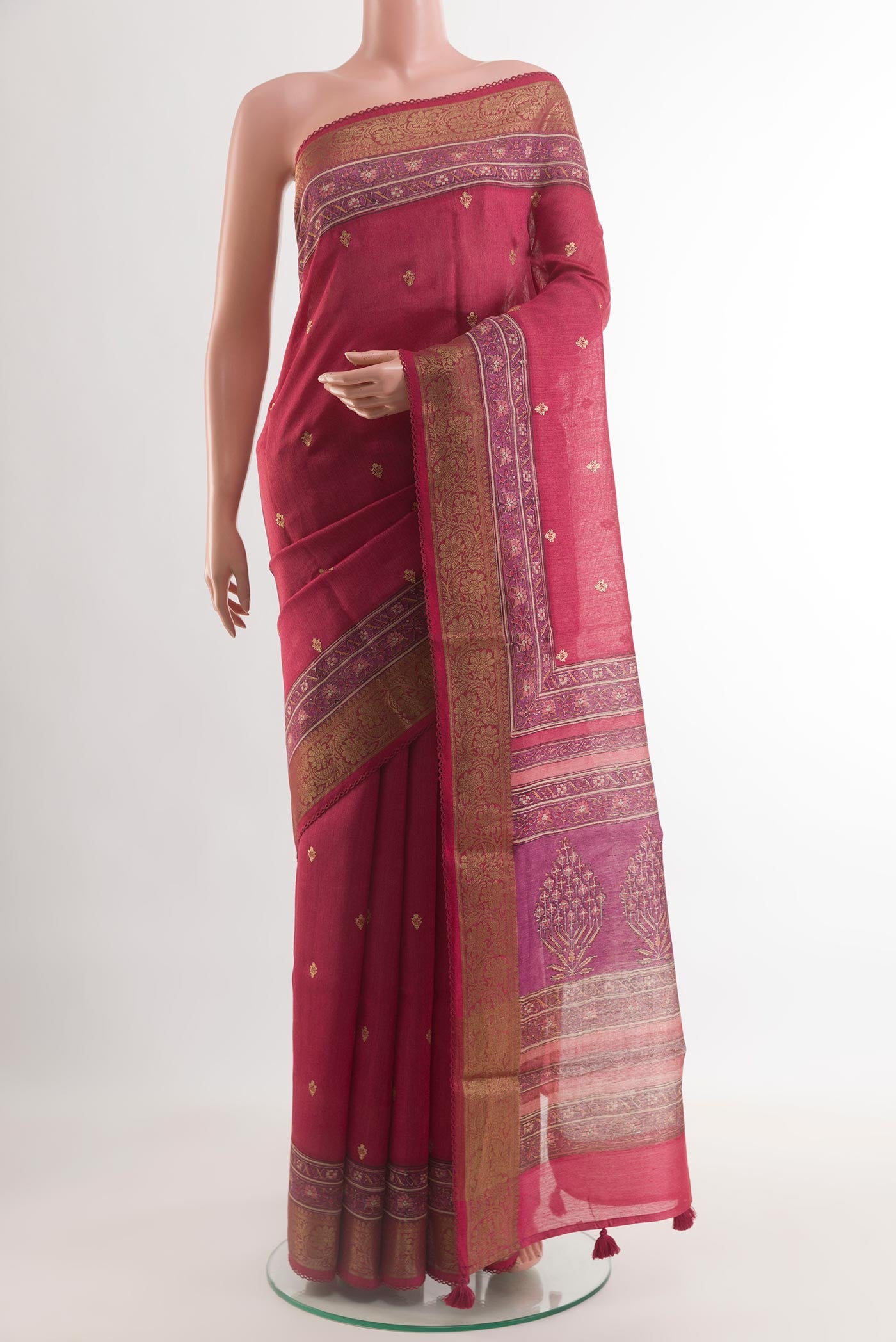 Red Tussar Silk Saree with Embroidery on the body and Zari Border.  displayed on a mannequin