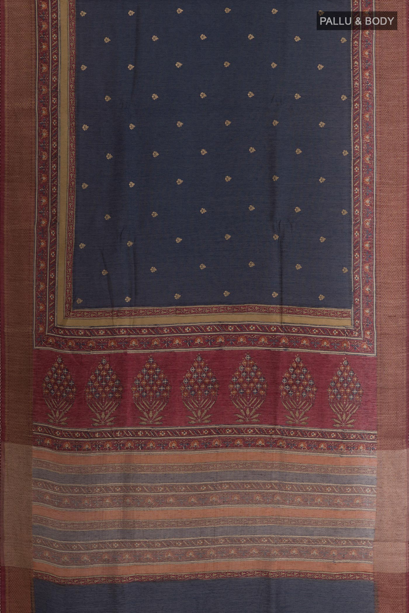 Flat view of Navy Blue Tussar Silk Saree with Printed design on the body and Zari Border. 