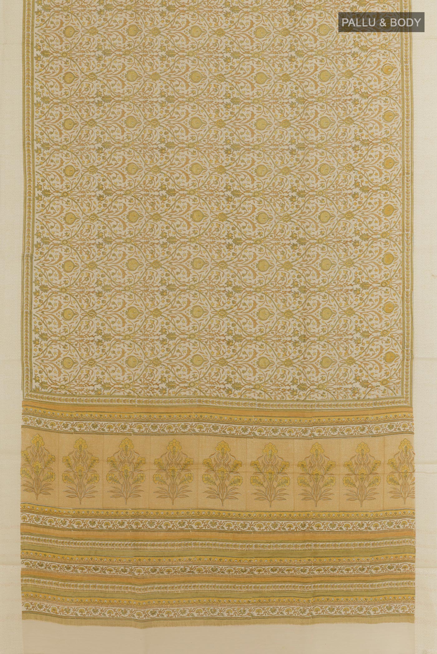 Flat view of Green Tussar Saree with Printed design on the body and Zari Border. 