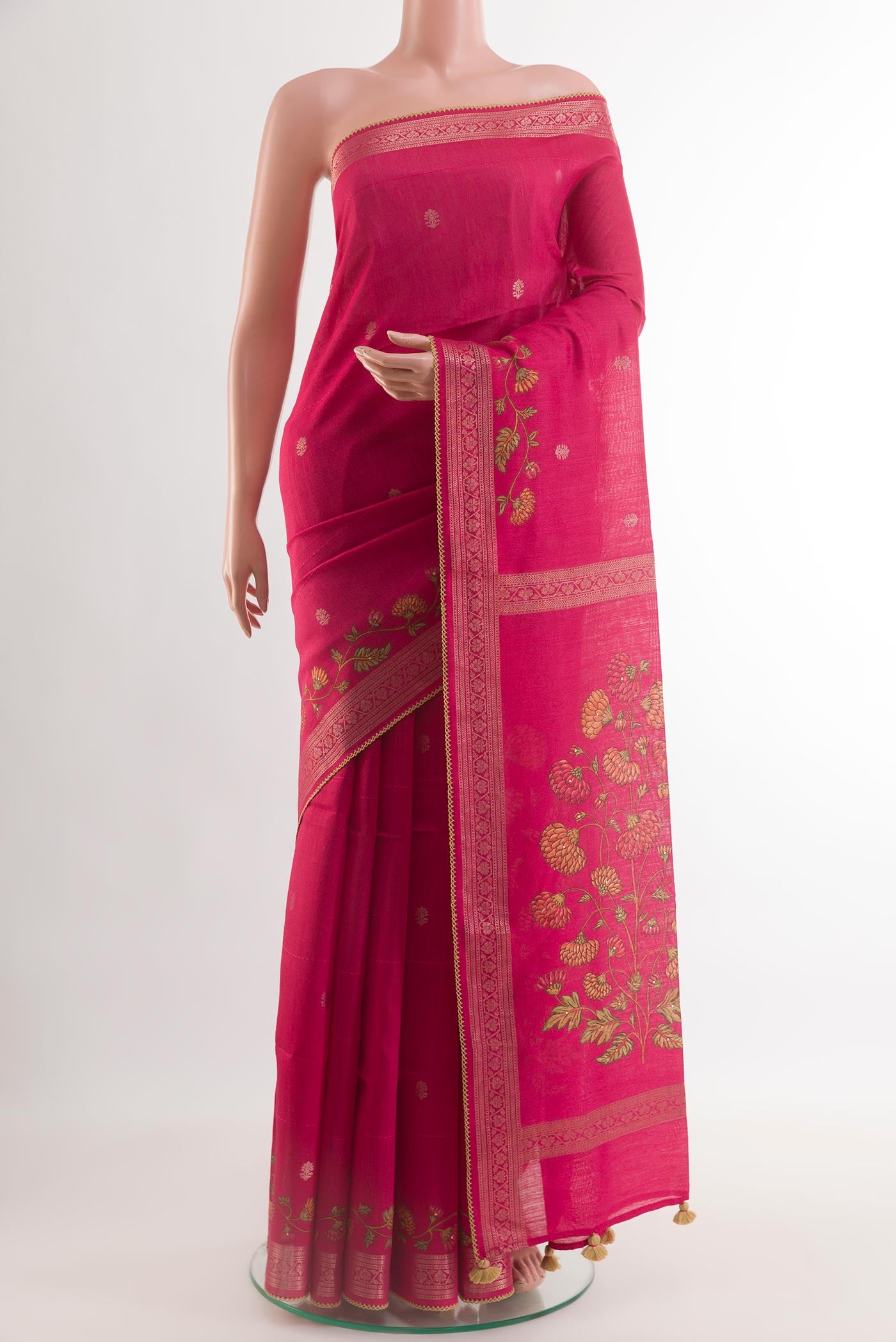 Pink Tussar Silk Saree with Embroidery on the body and Zari Border.  displayed on a mannequin