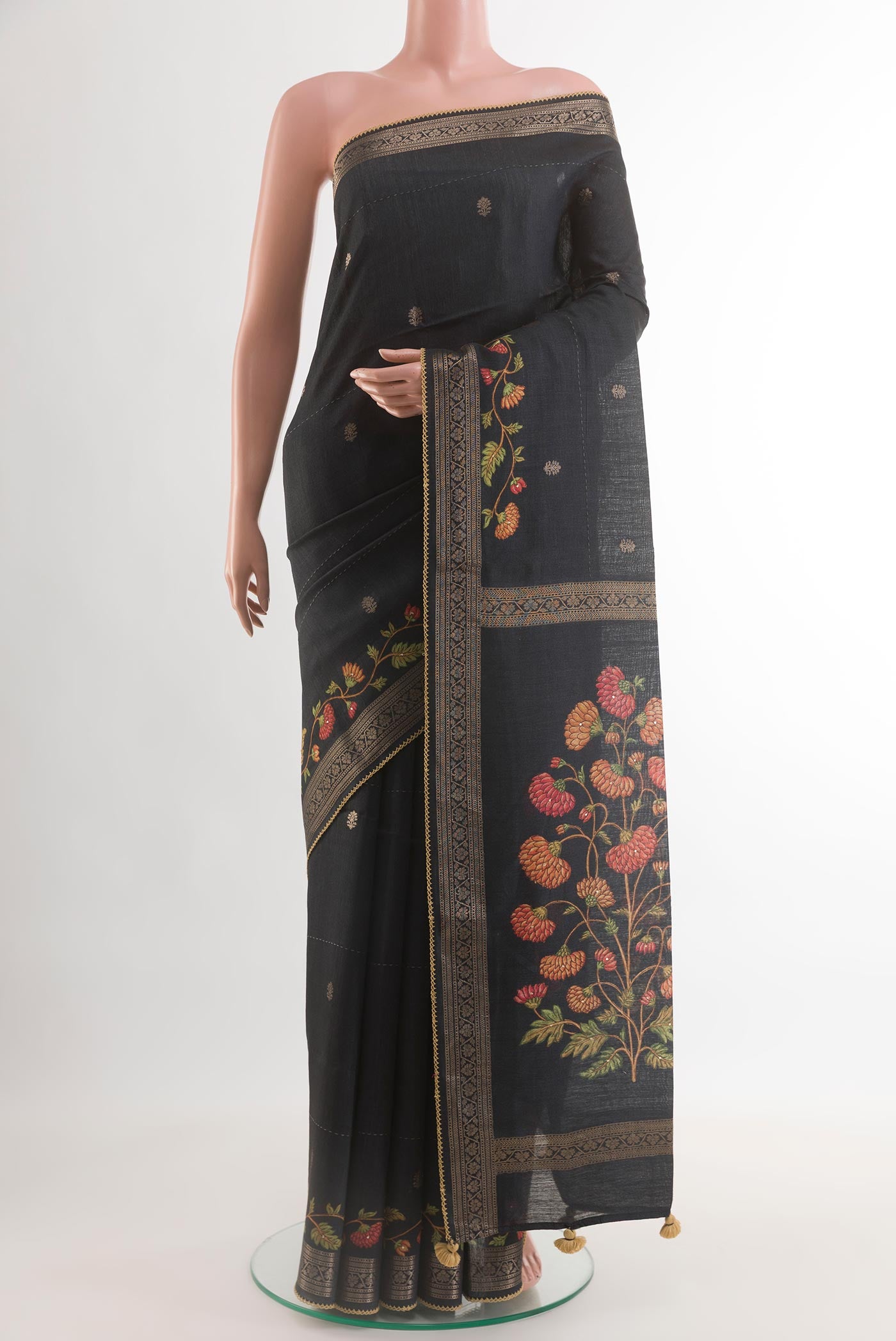 Black Tussar Silk Saree with Thread Butta on the body and Zari Border.  displayed on a mannequin