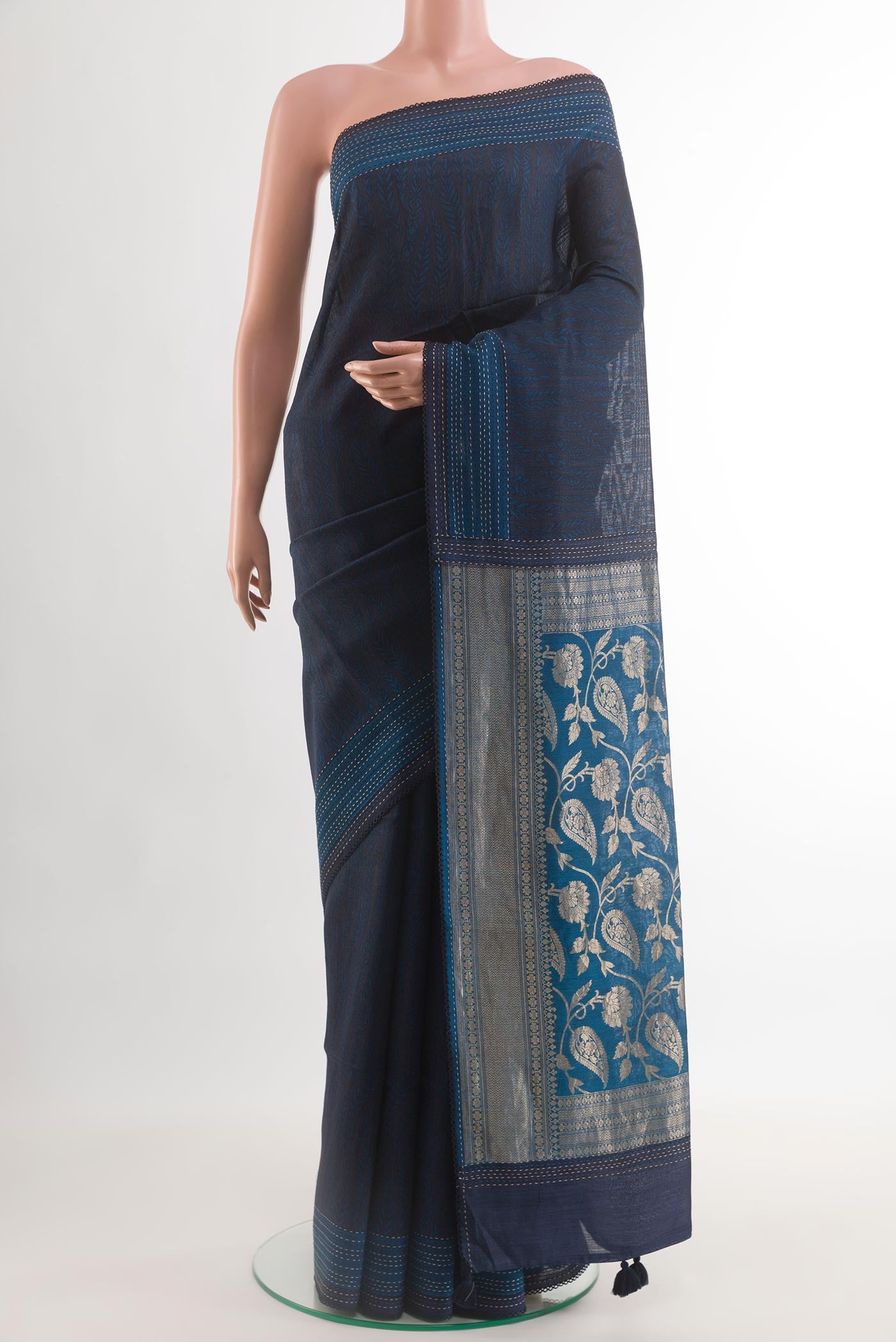 Blue Tussar Silk Saree with Stripes on the body and Zari Border.  displayed on a mannequin