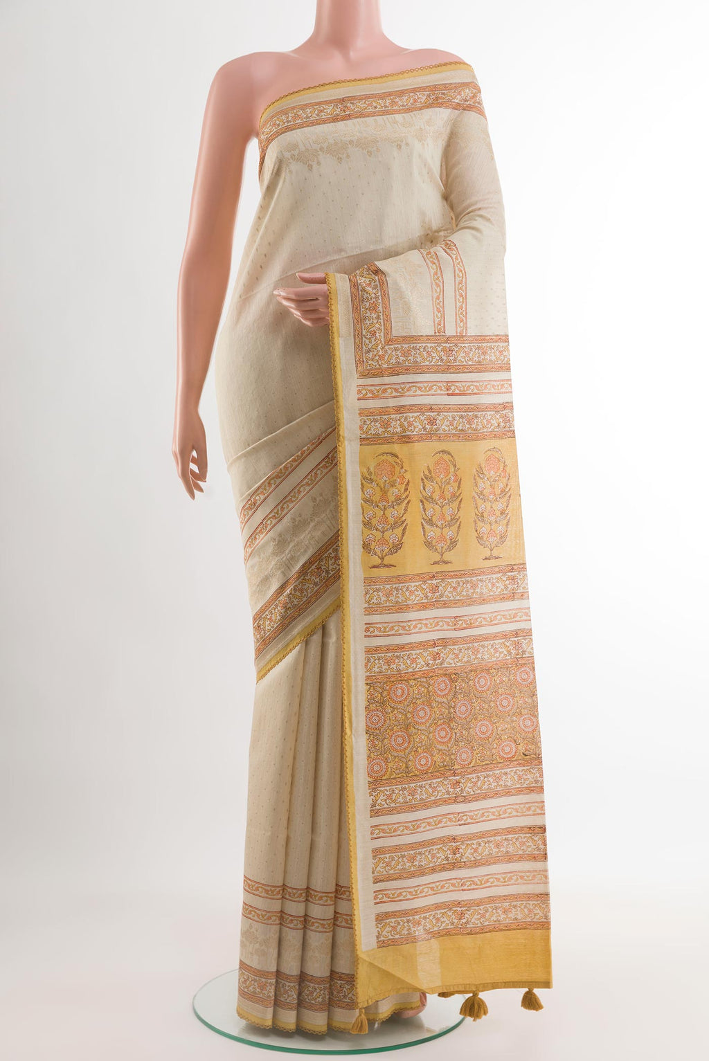 Cream Tussar Saree with Zari Butta on the body and Printed Border.  displayed on a mannequin