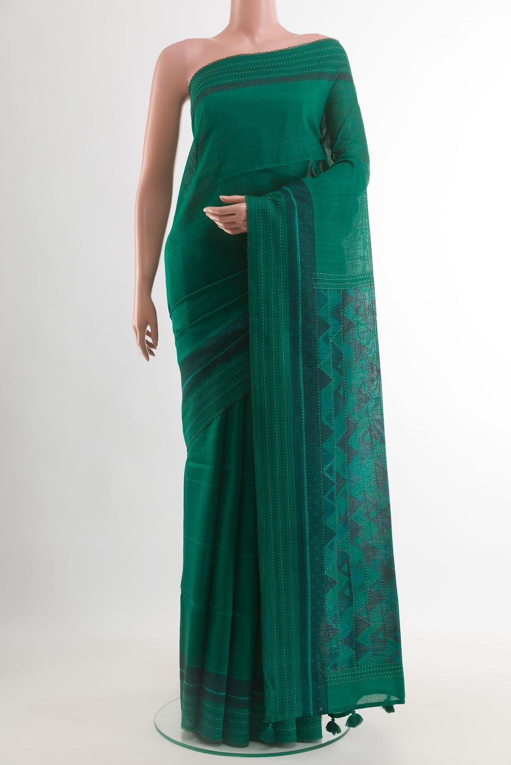 Green Tussar Silk Saree with Stripes on the body and Thread Border.  displayed on a mannequin