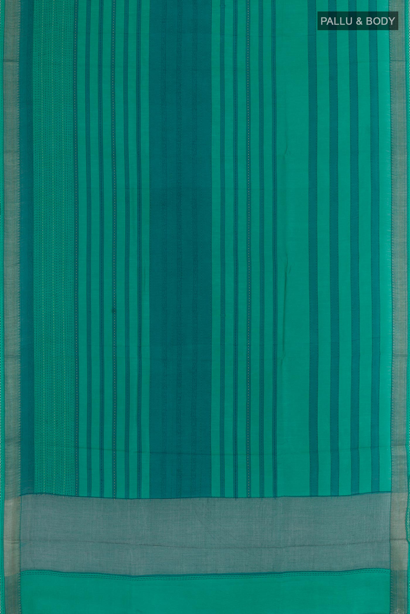 Flat view of Sea Green Tussar Silk Saree with Printed design on the body and Zari Border. 
