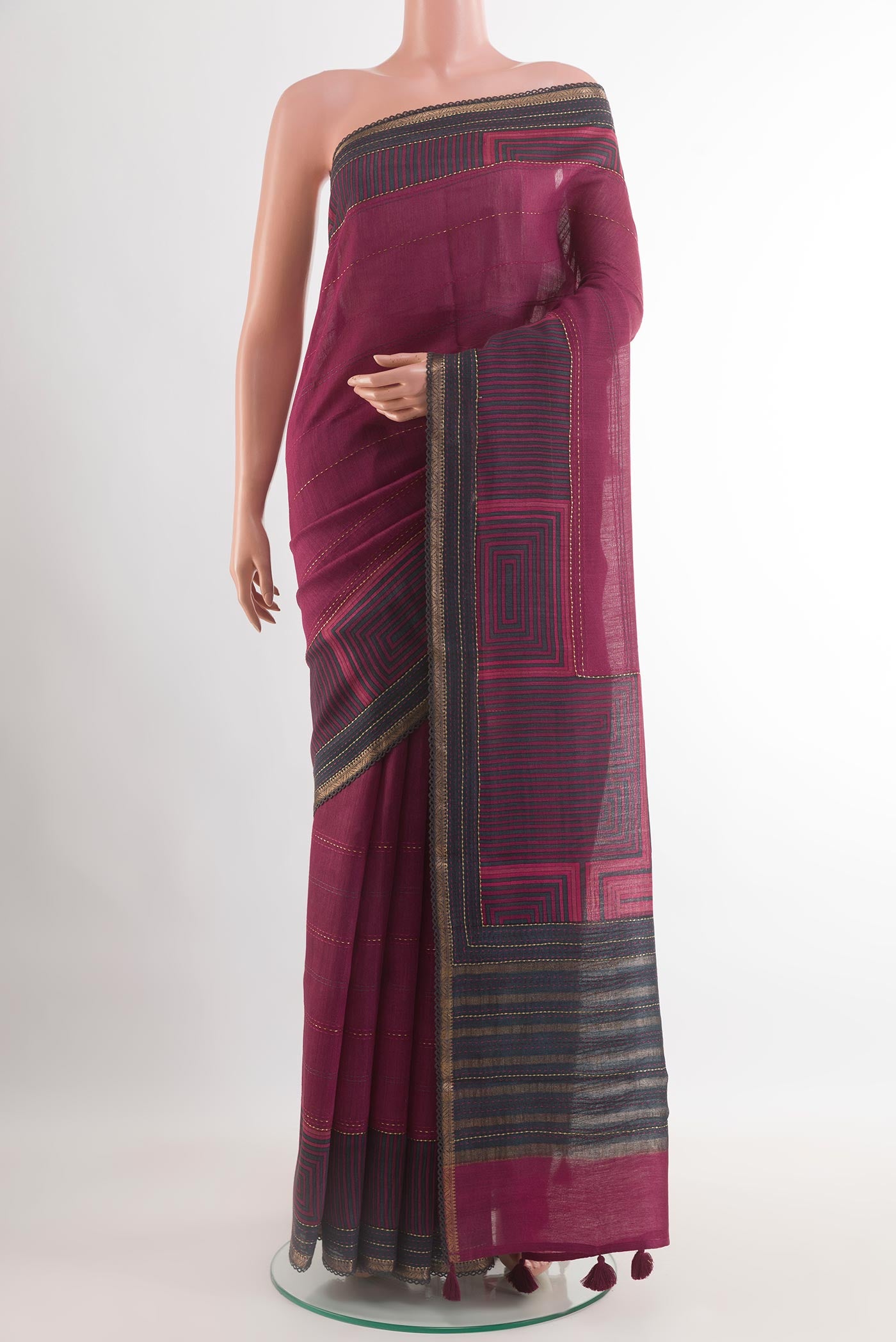 Purple Tussar Saree with Printed design on the body and Zari Border.  displayed on a mannequin
