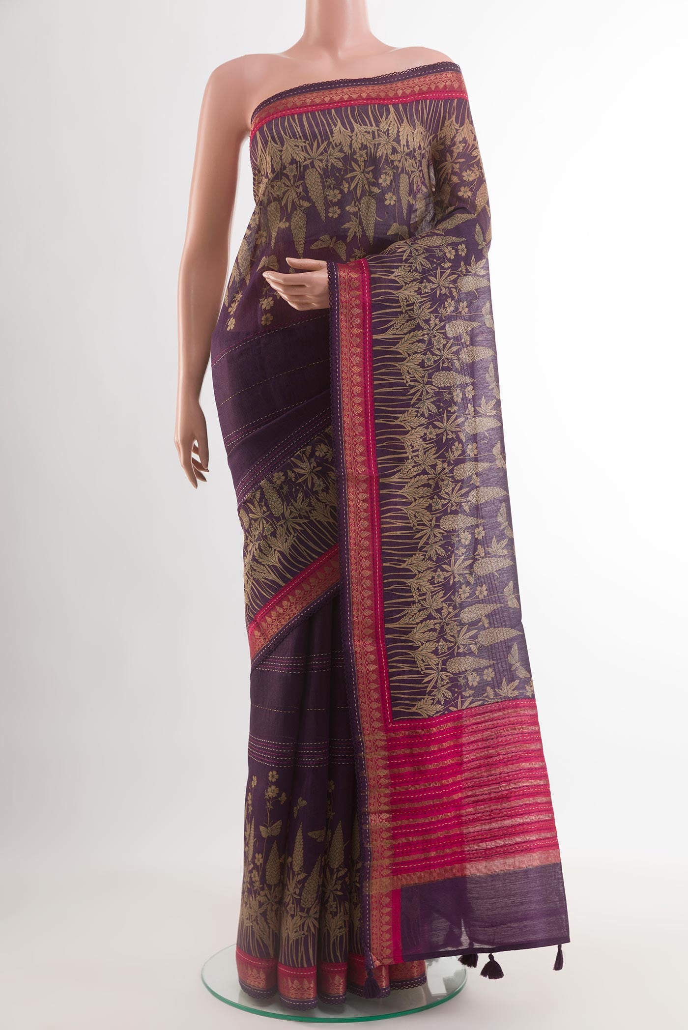Purple Tussar Saree with Printed design on the body and Zari Border.  displayed on a mannequin