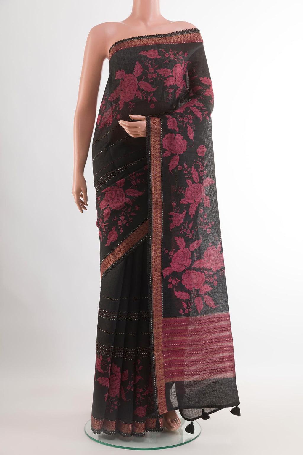 Black Tussar Saree with Stripes on the body and Zari Border.  displayed on a mannequin