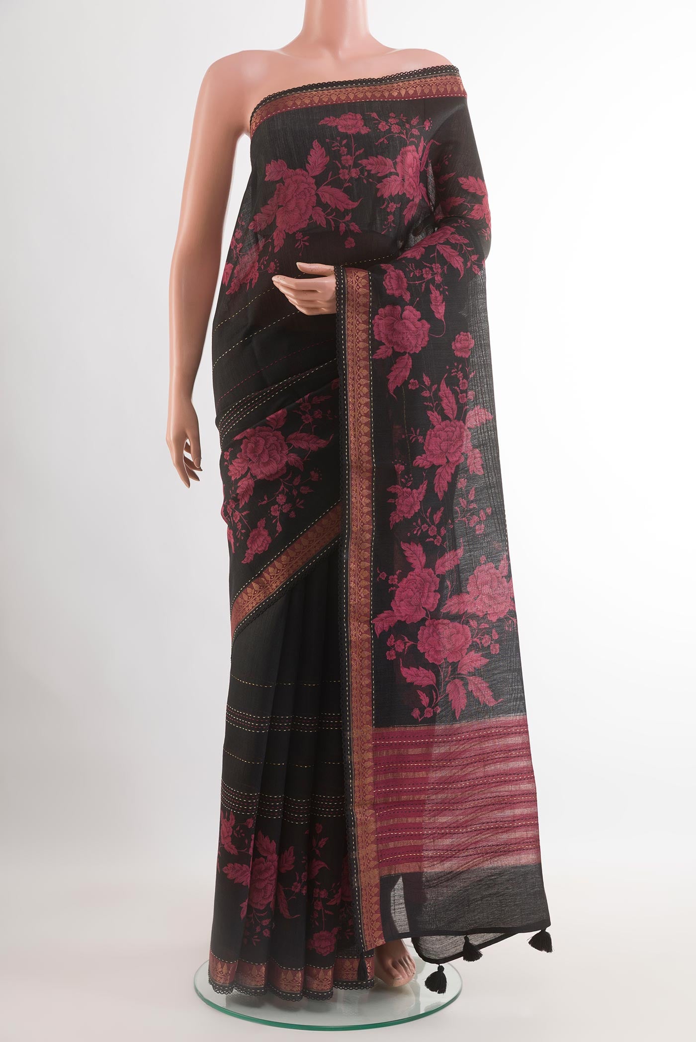Black Tussar Saree with Stripes on the body and Zari Border.  displayed on a mannequin