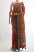 Maroon Tussar Silk Saree with Printed design on the body and Zari Border.  displayed on a mannequin