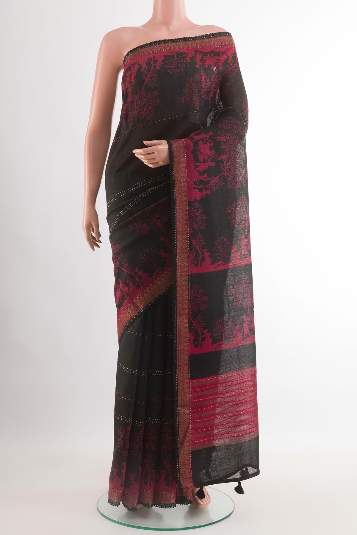 Black Tussar Saree with Stripes on the body and Zari Border.  displayed on a mannequin