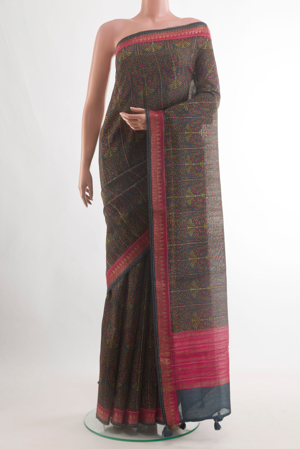 Navy Blue Tussar Silk Saree with Printed design on the body and Zari Border.  displayed on a mannequin