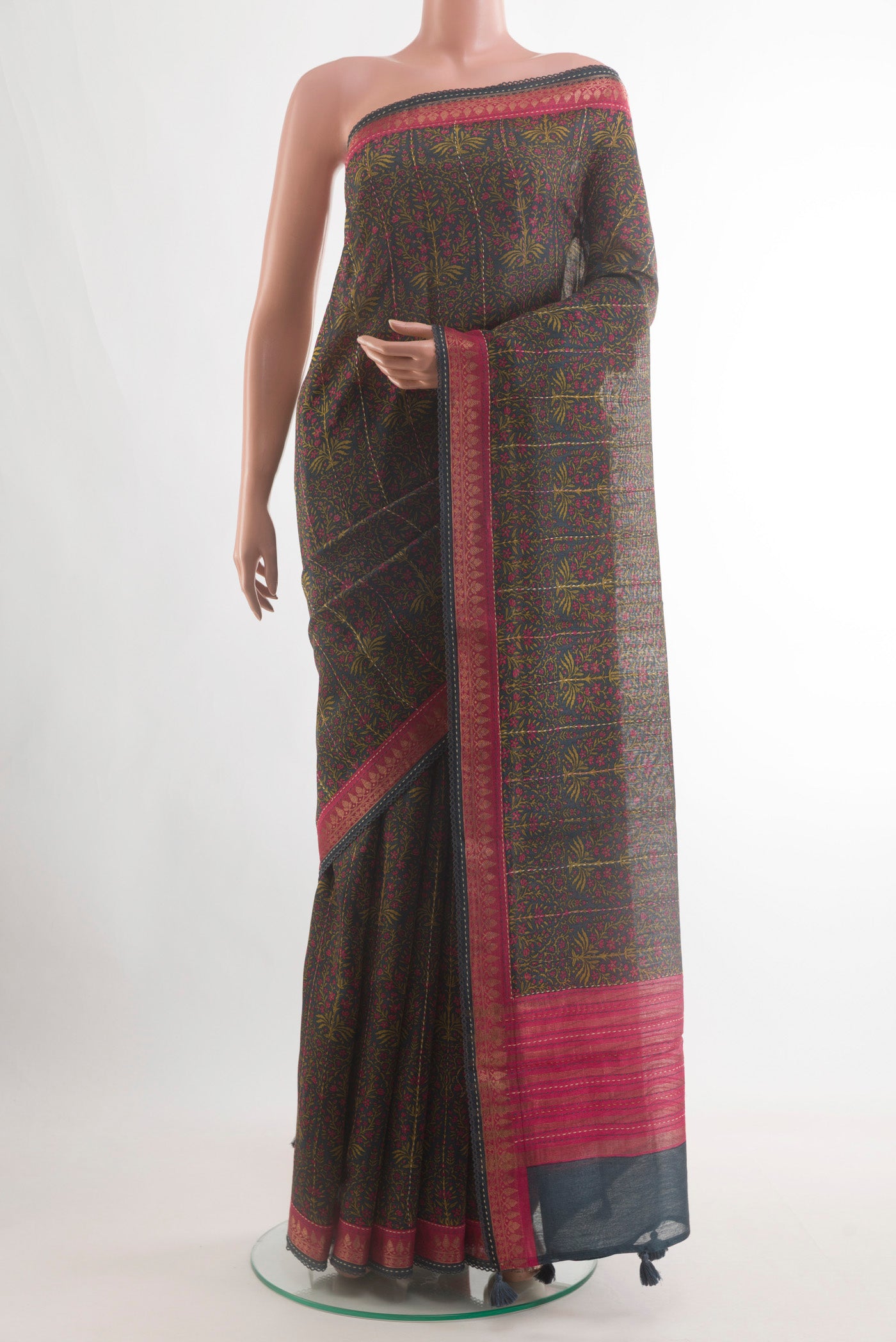 Navy Blue Tussar Silk Saree with Printed design on the body and Zari Border.  displayed on a mannequin