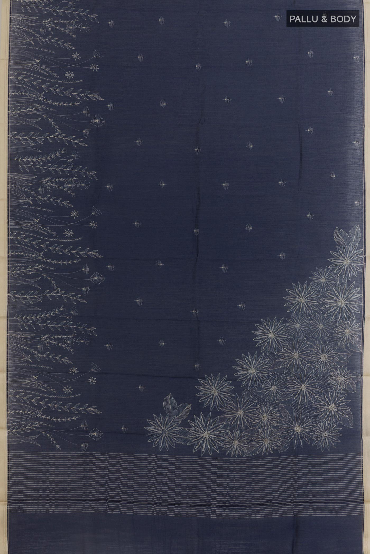 Flat view of Navy Blue Tussar Silk Saree with Printed design on the body and Zari Border. 