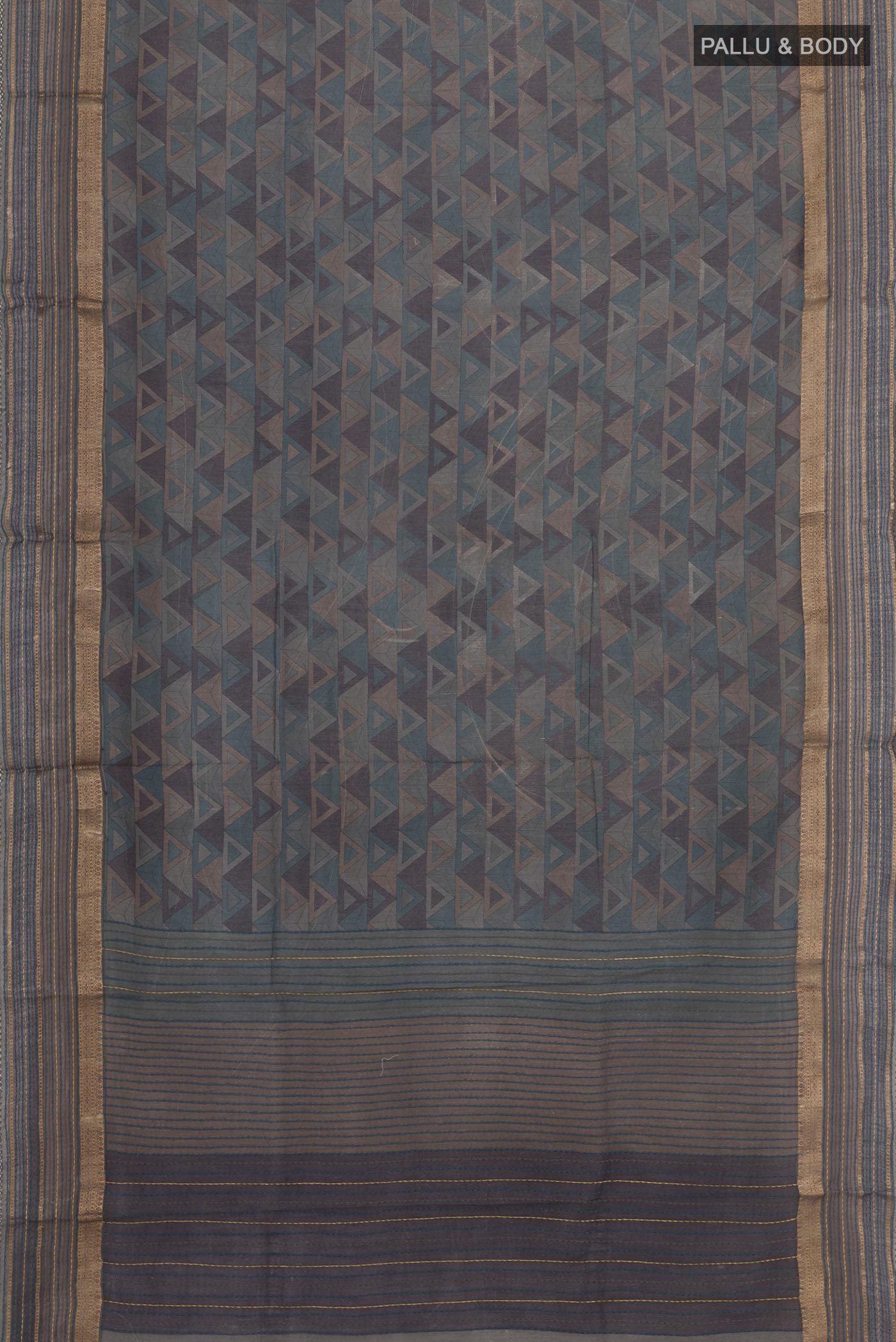 Flat view of Grey Tussar Saree with Printed design on the body and Zari Border. 