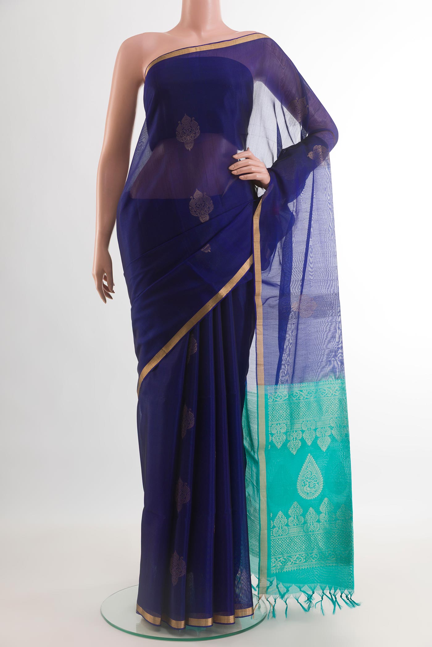 Blue Silk Cotton Saree with Zari Butta on the body and Zari Border.  displayed on a mannequin