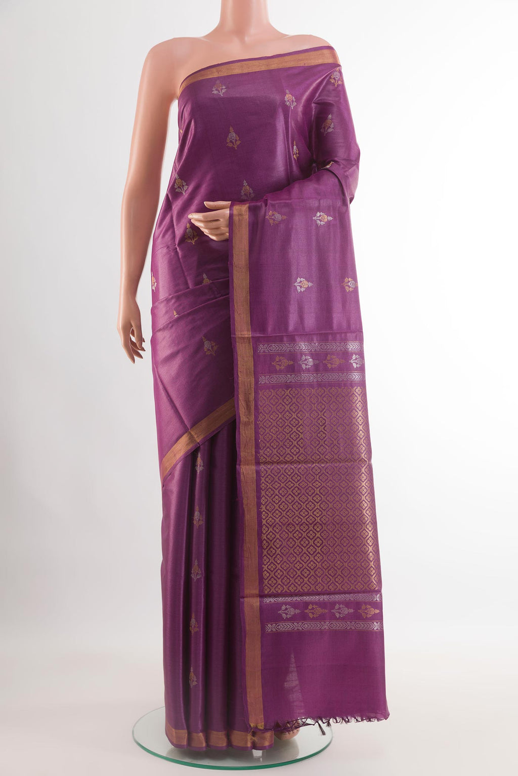 Purple Tussar Saree with Zari Butta on the body and Zari Border.  displayed on a mannequin