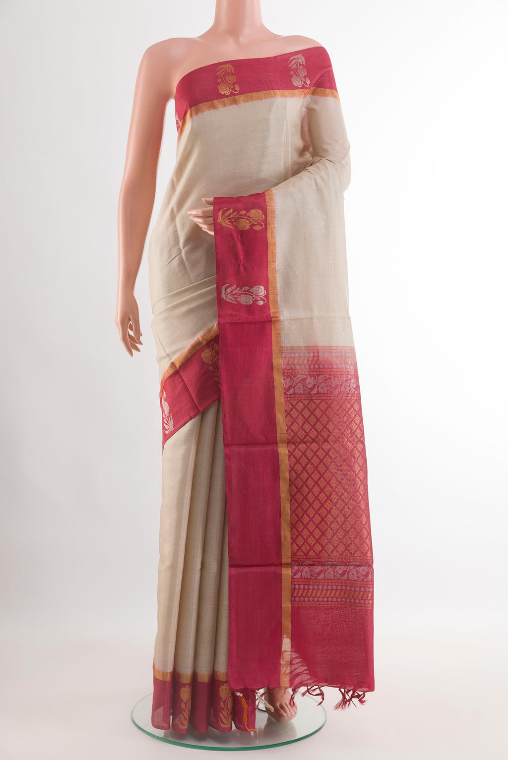 Off White Tussar Saree with Plain Body and Zari Border.  displayed on a mannequin