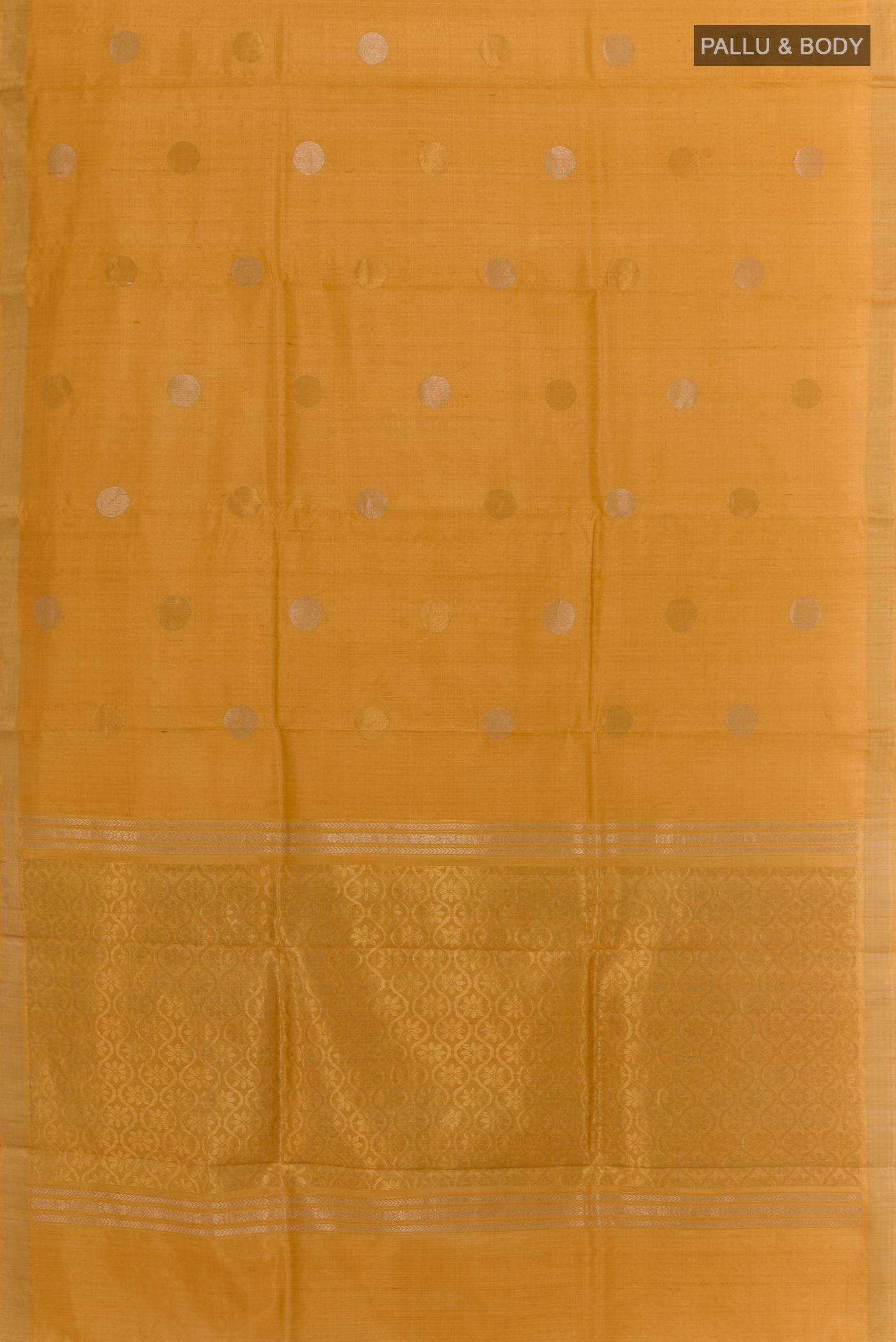 Flat view of Yellow Tussar Saree with Zari Butta on the body and Zari Border. 